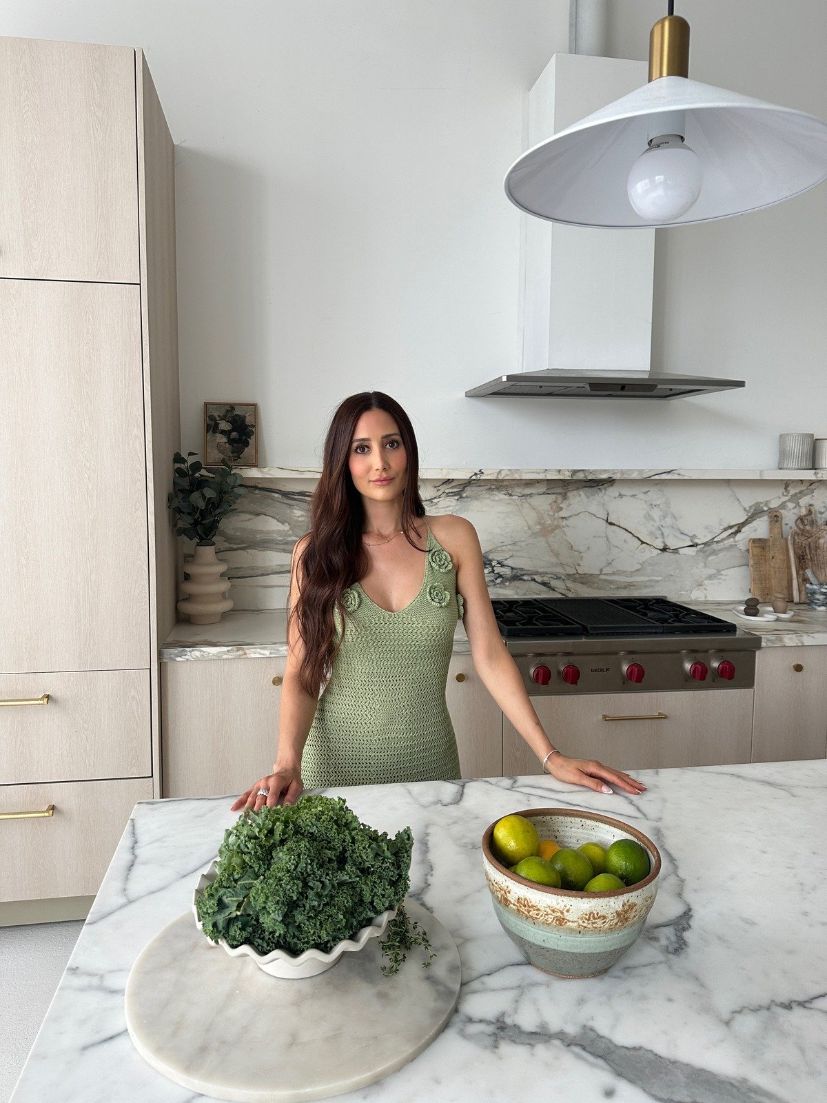 Sunny in her kitchen with fresh produce